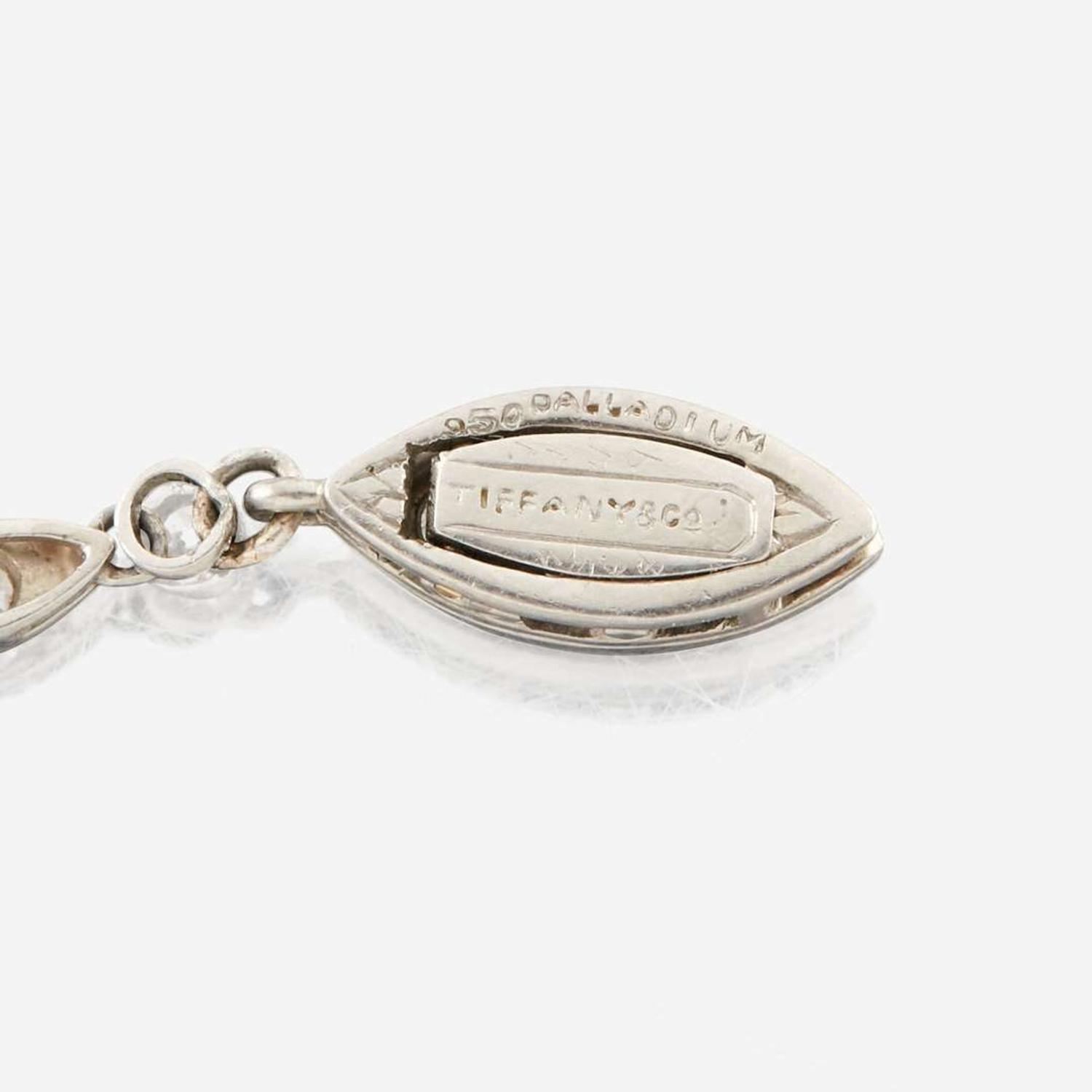 A diamond, aquamarine, and palladium pendant necklace, Tiffany & Co.