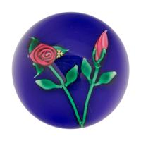 A Charles Kaziun Jr. Red Rope Rose and Bud on Blue Ground Glass Paperweight