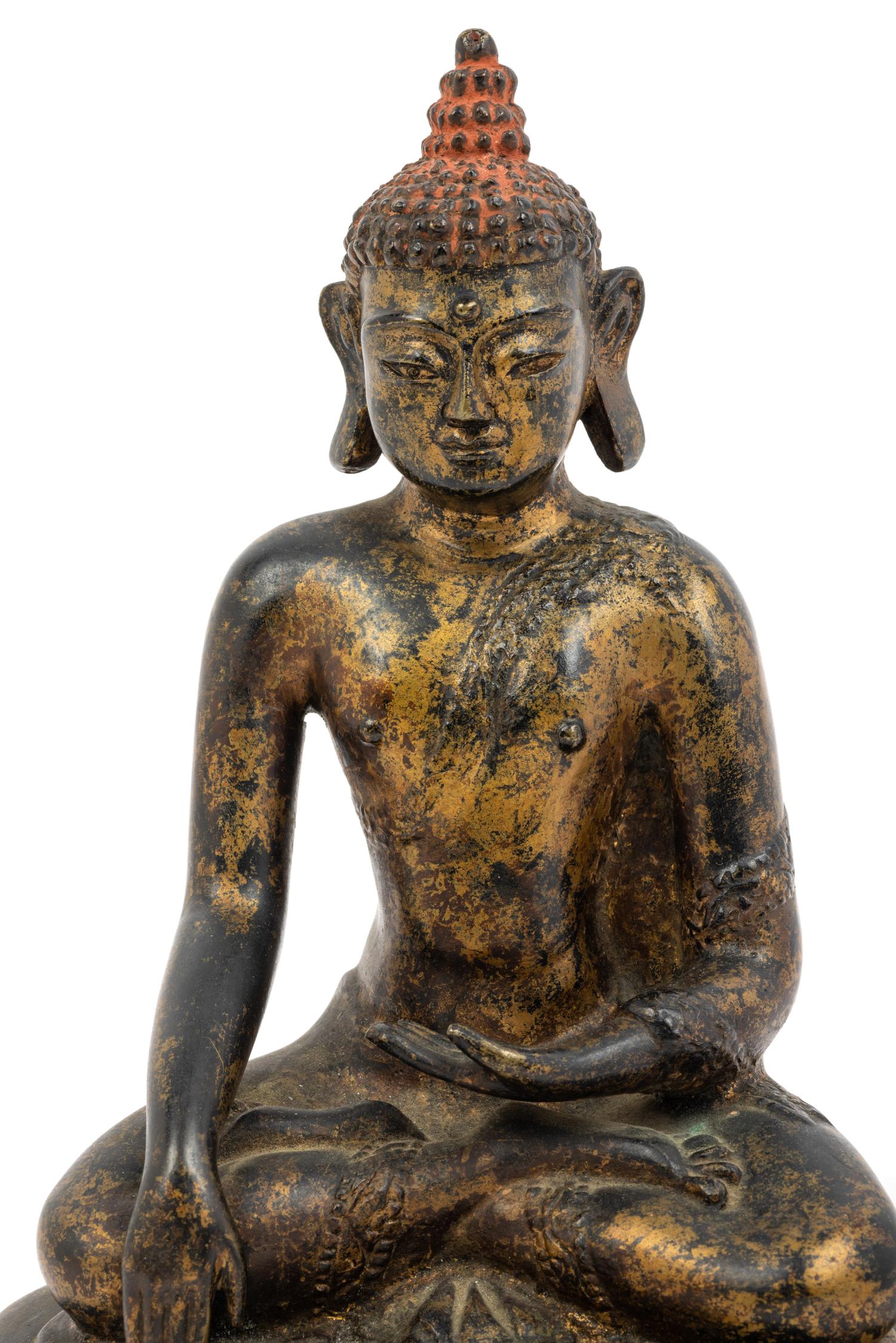A Large Nepalese Gilt Bronze Figure of Seated Buddha