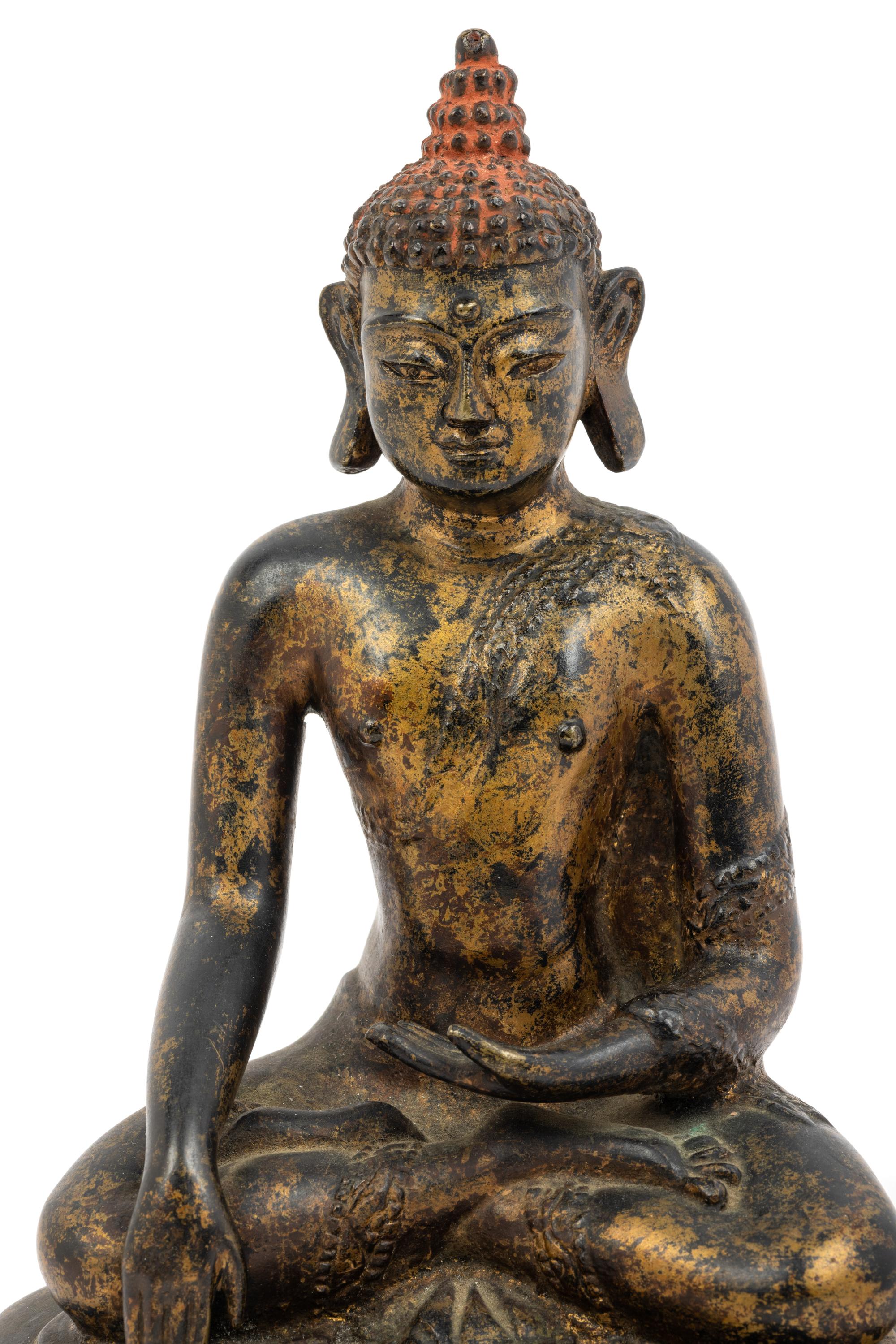 A Large Nepalese Gilt Bronze Figure of Seated Buddha