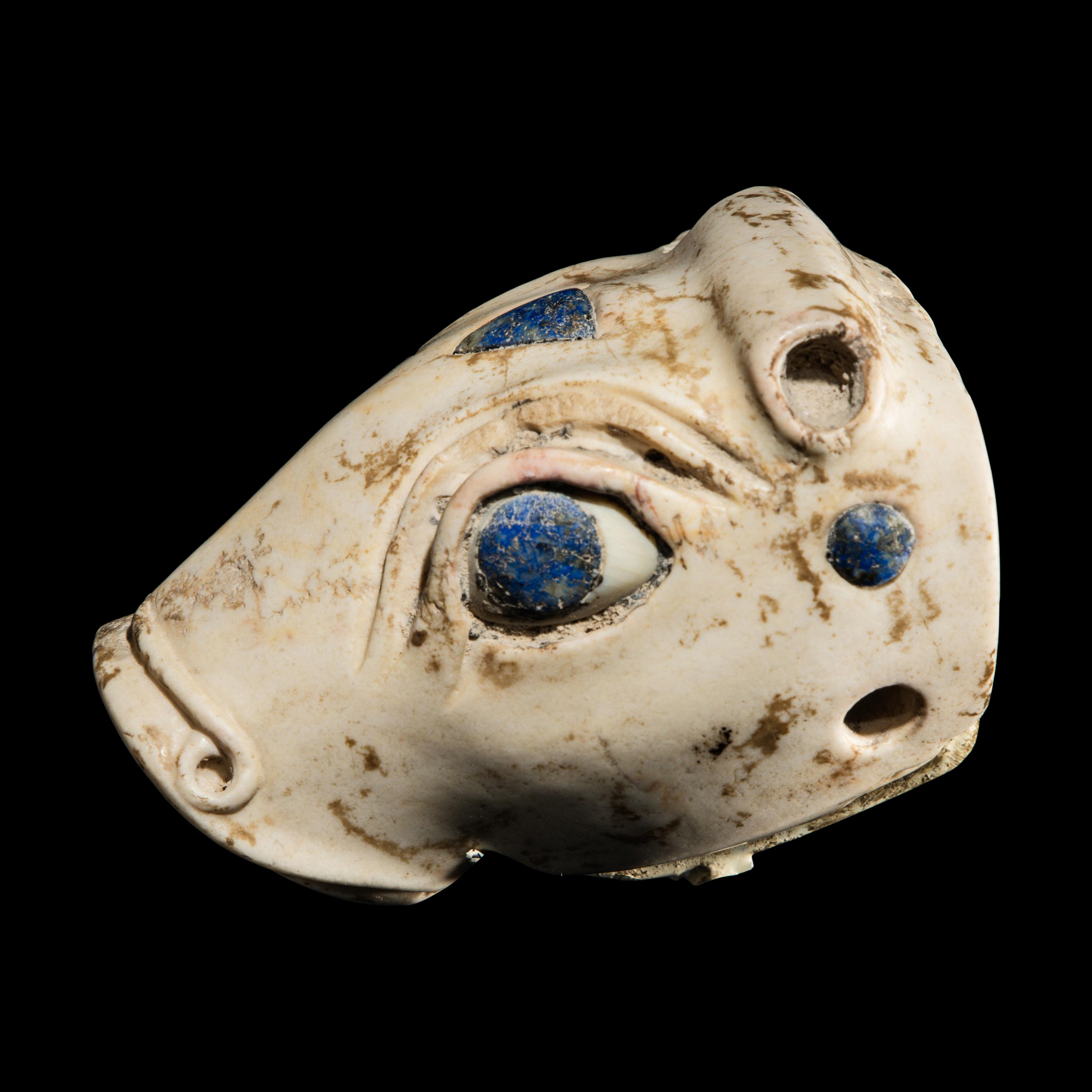 A Mesopotamian Marble and Lapis Lazuli Inlay Bull Head