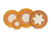 A Minton Parcel Gilt Porcelain Dinner Service by S.J. Russell