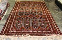 A Group of Four Wool Rugs Dimensions of largest 9 feet 7 inches x 6 feet 4 inches.