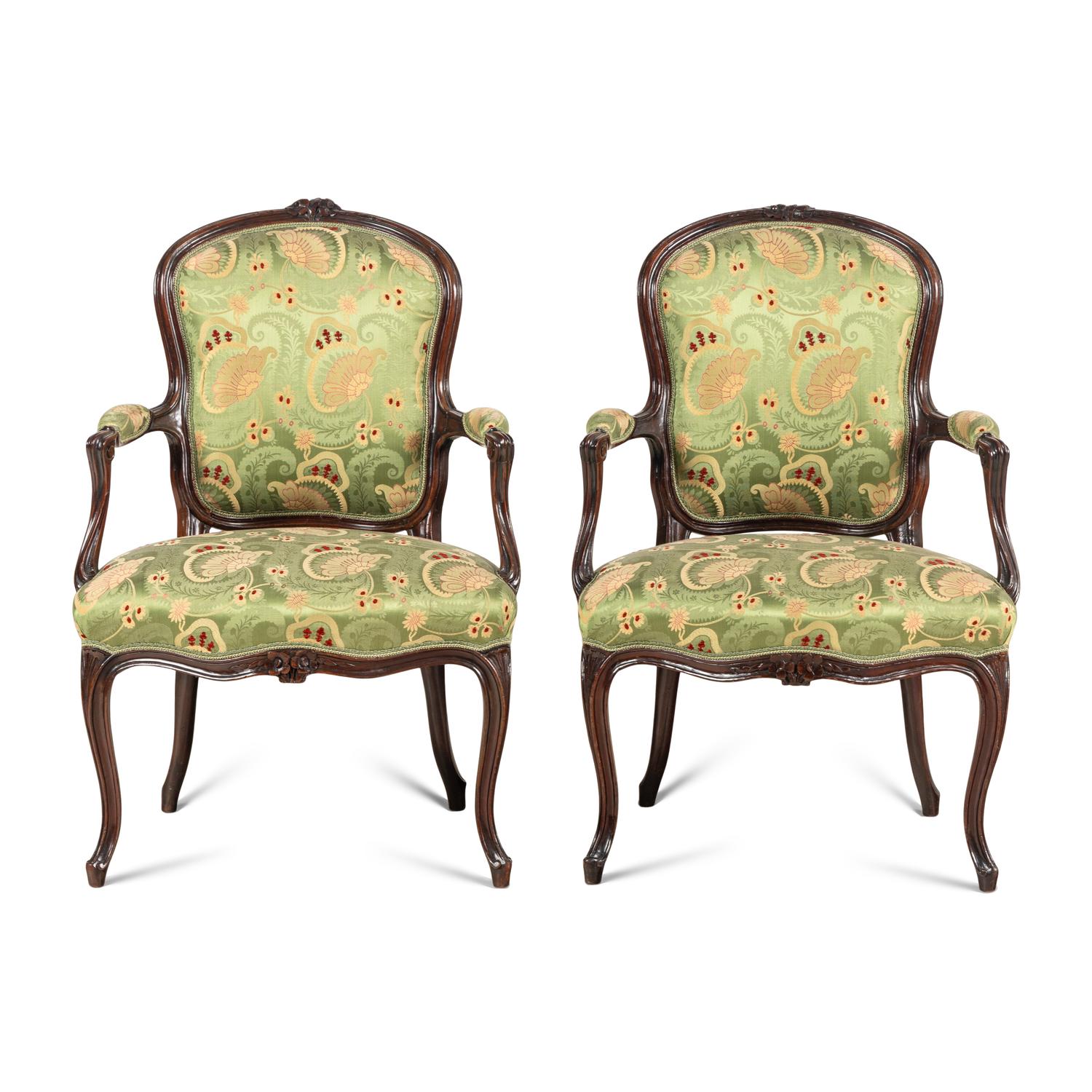A Pair of Louis XV Style Carved Mahogany Armchairs