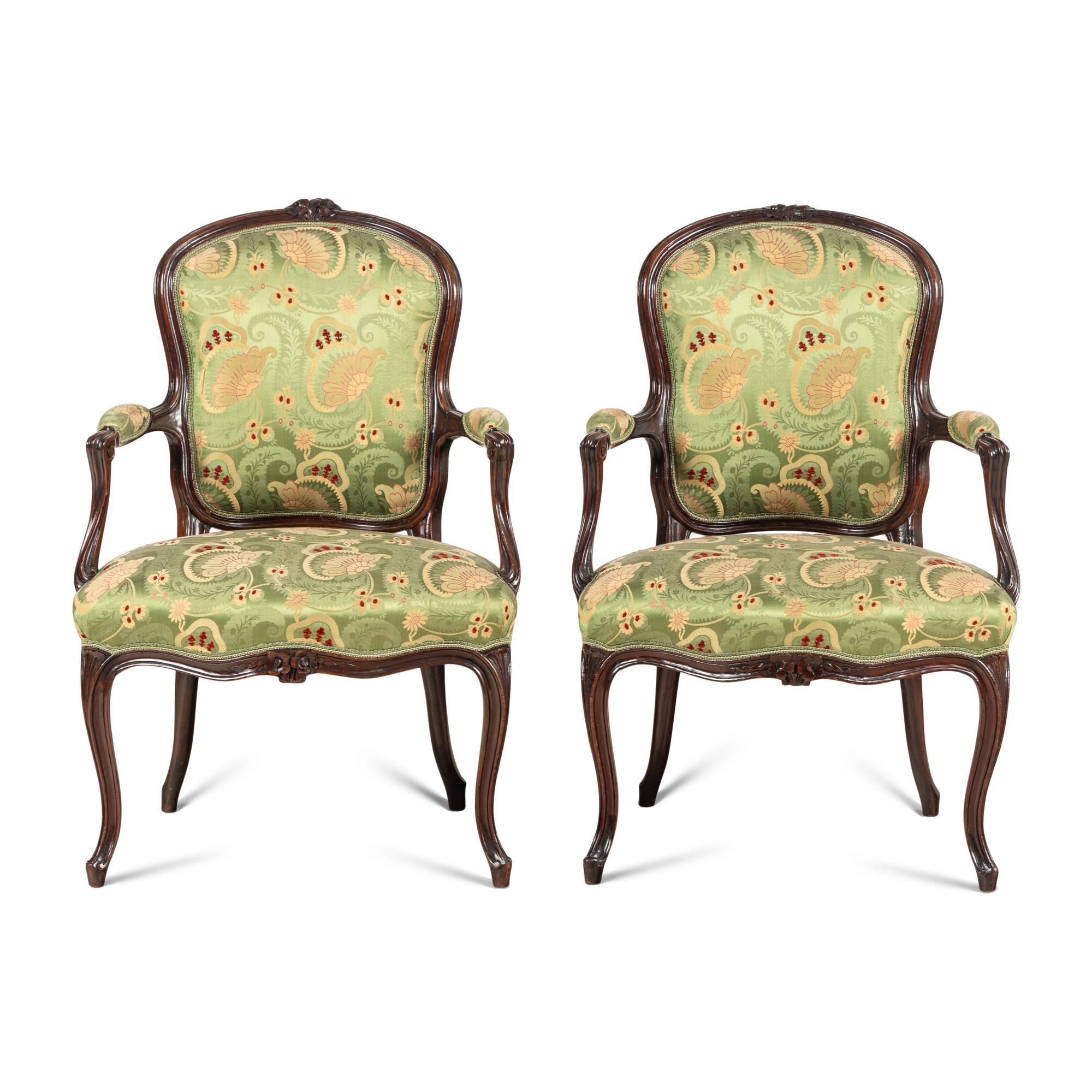 A Pair of Louis XV Style Carved Mahogany Armchairs