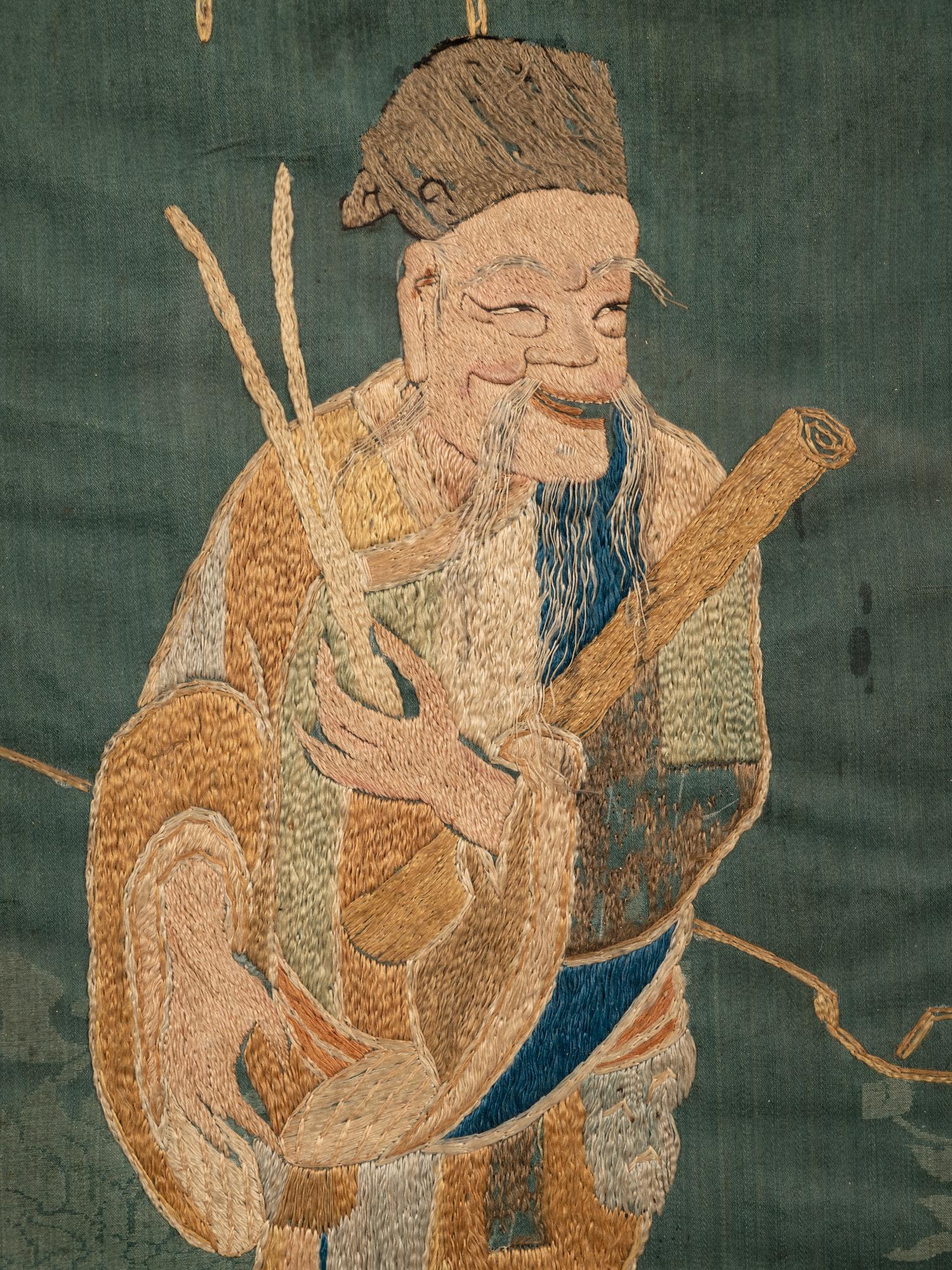 Two Chinese Blue Ground Embroidered Silk Panels
