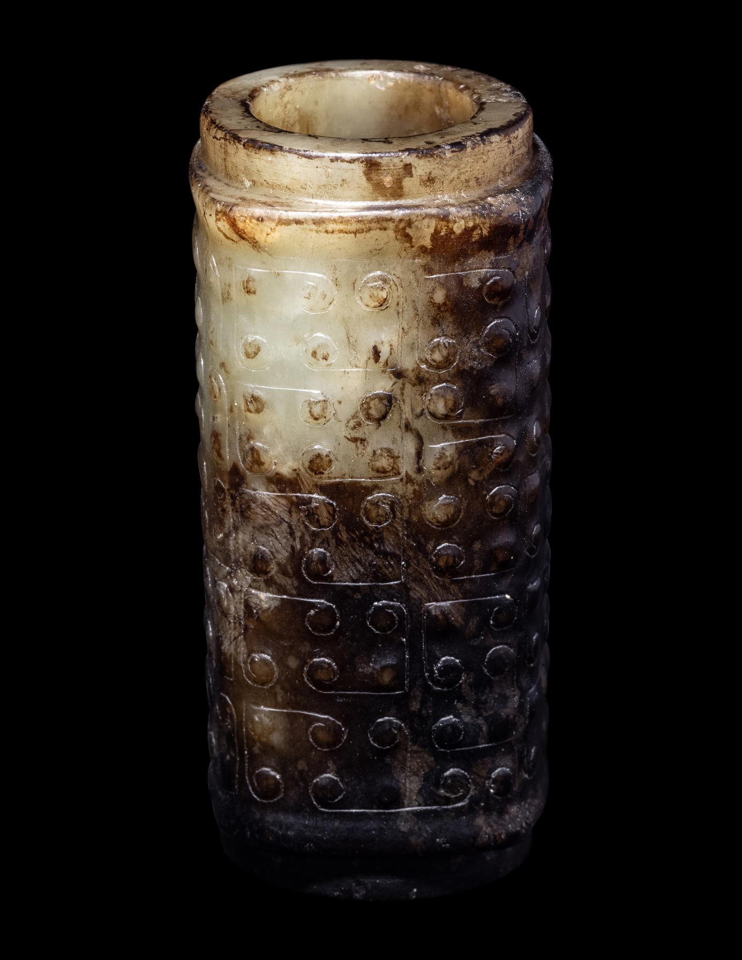 A Small Chinese Dark Russet and Celadon Jade Cong