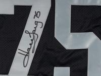 A Group of Howie Long Signed Autograph Items Featuring a Game Model Raiders Jersey
