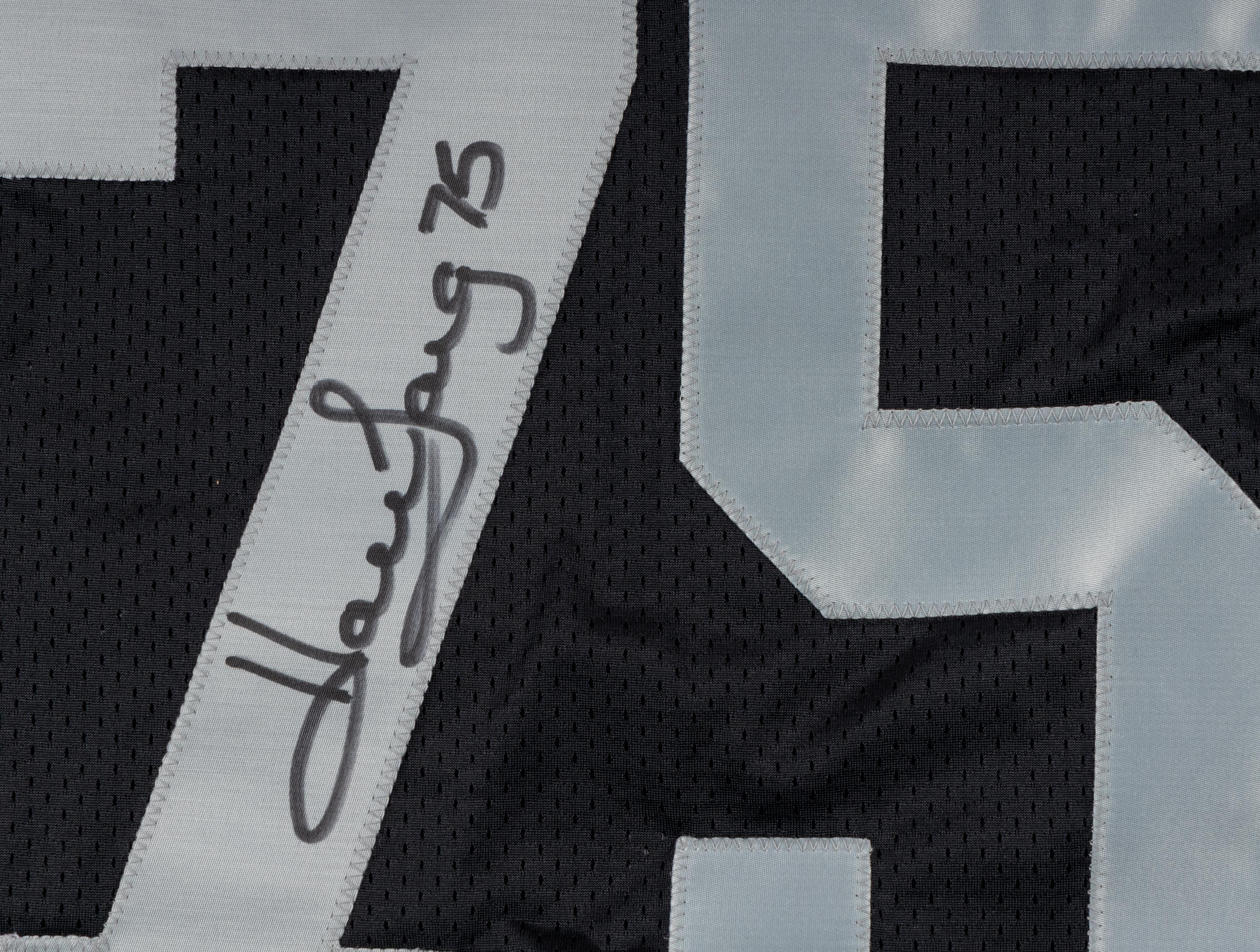 A Group of Howie Long Signed Autograph Items Featuring a Game Model Raiders Jersey