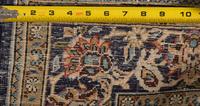 A Kashan Hunting Scene Wool Rug