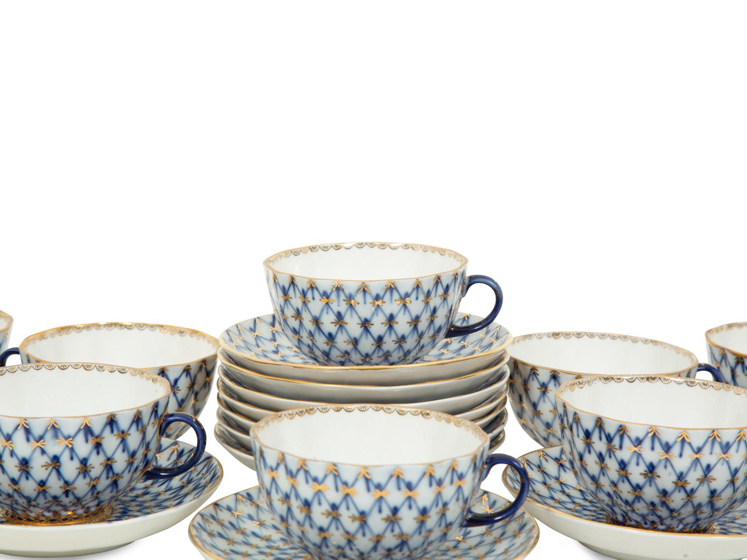 A Set of Twelve Lomonosov Cobalt Net Porcelain Teacups and Saucers