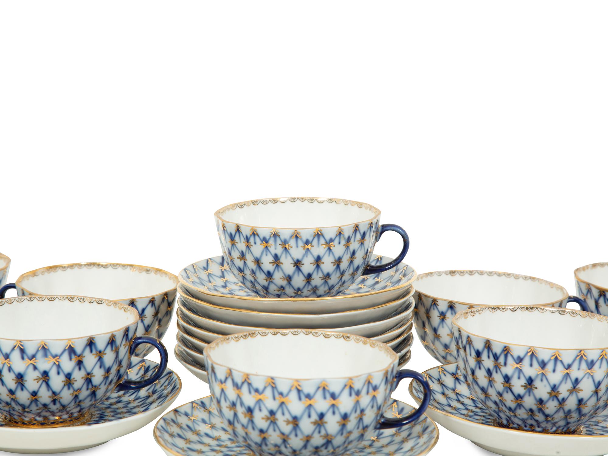 A Set of Twelve Lomonosov Cobalt Net Porcelain Teacups and Saucers