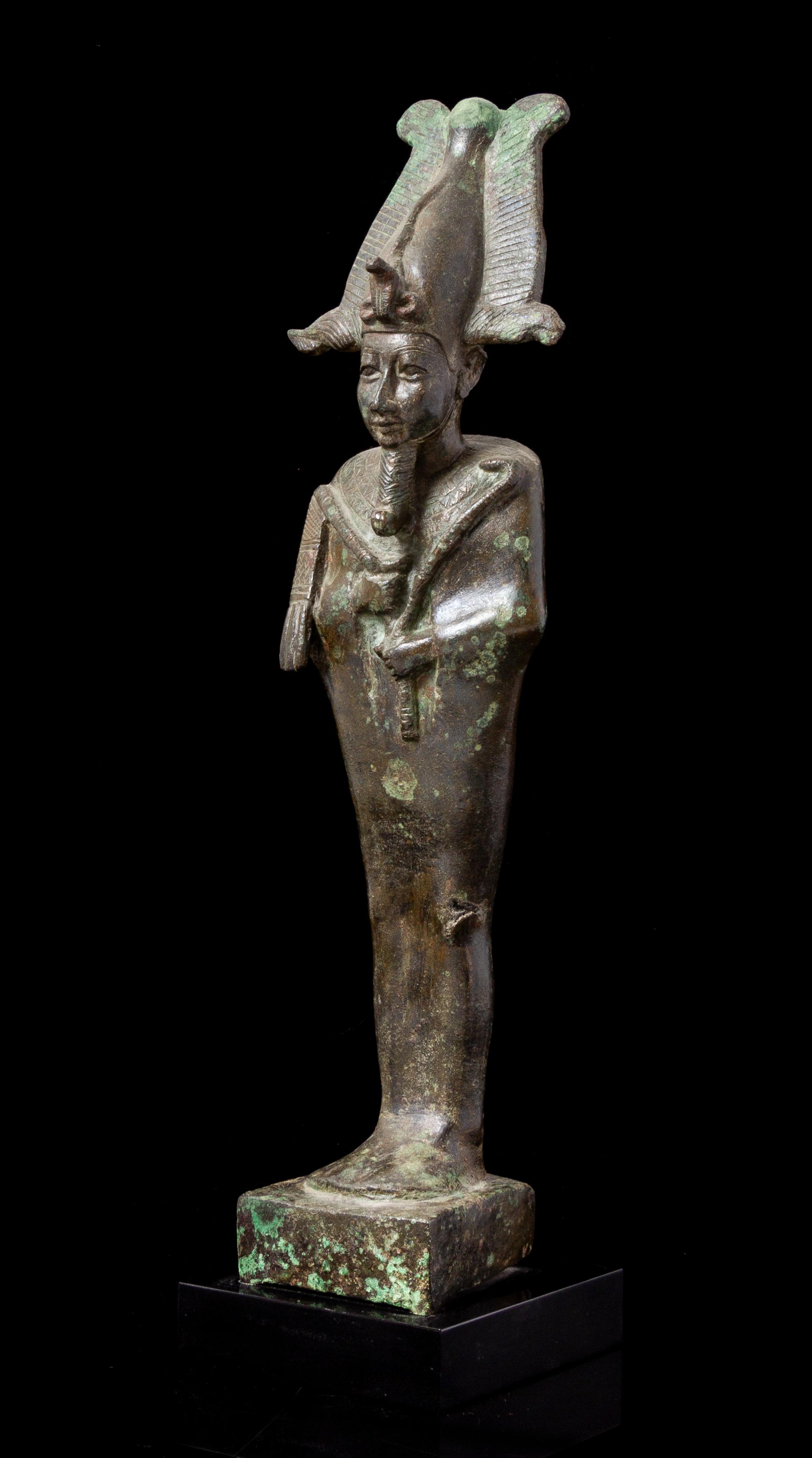 An Egyptian Bronze Standing Osiris Height 11 inches. — LATE PERIOD, DYNASTY 26-30, 664-343 B.C.E.