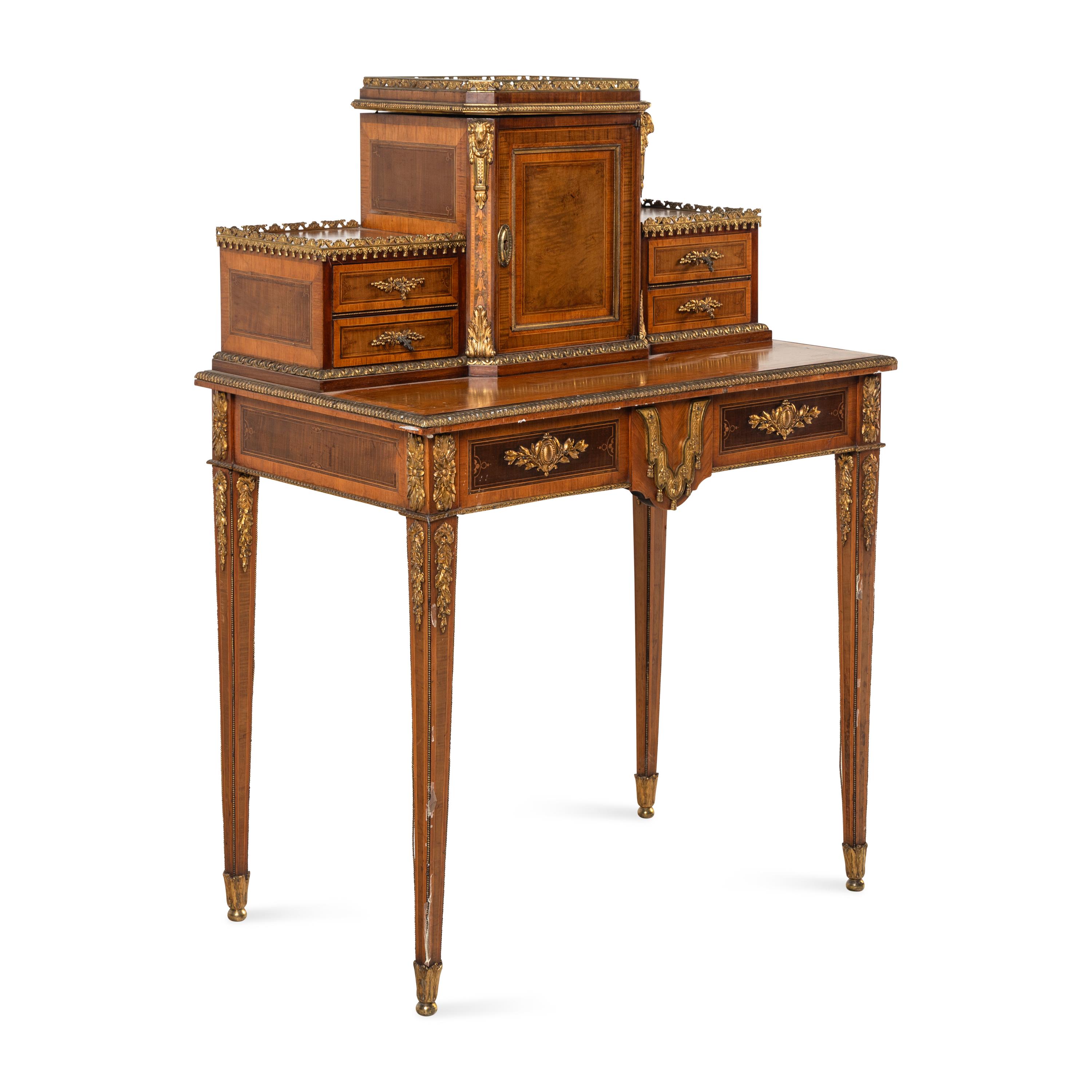 A Louis XVI Style Kingwood, Satinwood and Gilt Bronze Mounted Bonheur du Jour