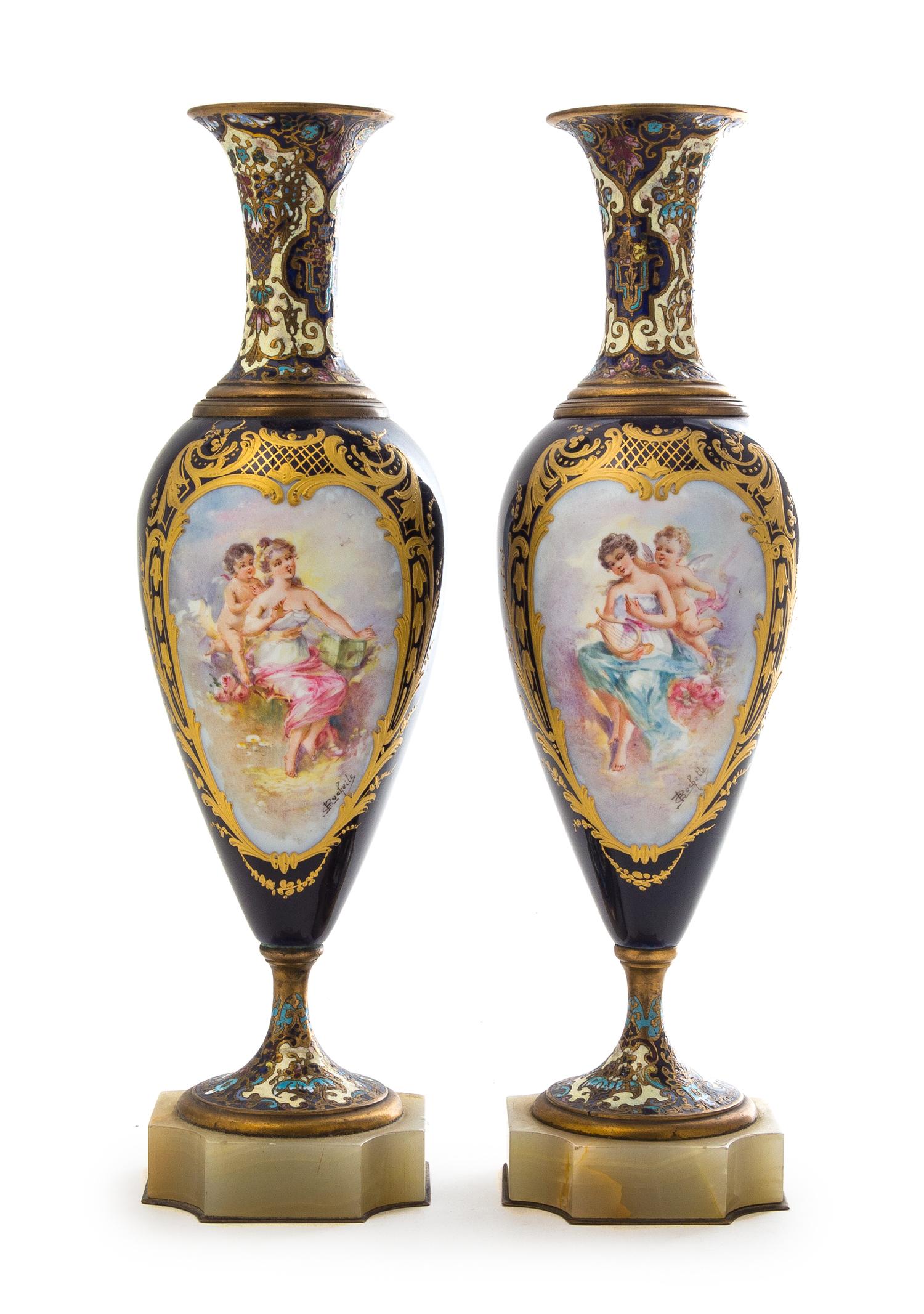A Pair of Sevres Style Porcelain, Onyx and Champleve Urns Height 12 3/8 inches.