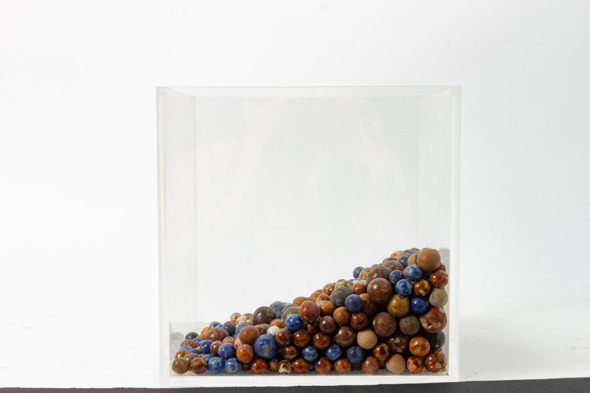 An Early Collection of Glass and Clay Marbles
