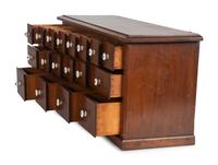 A Miniature Painted Wood Apothecary Cabinet with Porcelain Pulls