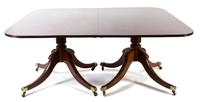 A George III Style Mahogany Two-Pedestal Dining Table Height 29 x length with leaves 104 x depth 55 1/2 inches. — 19TH CENTURY
