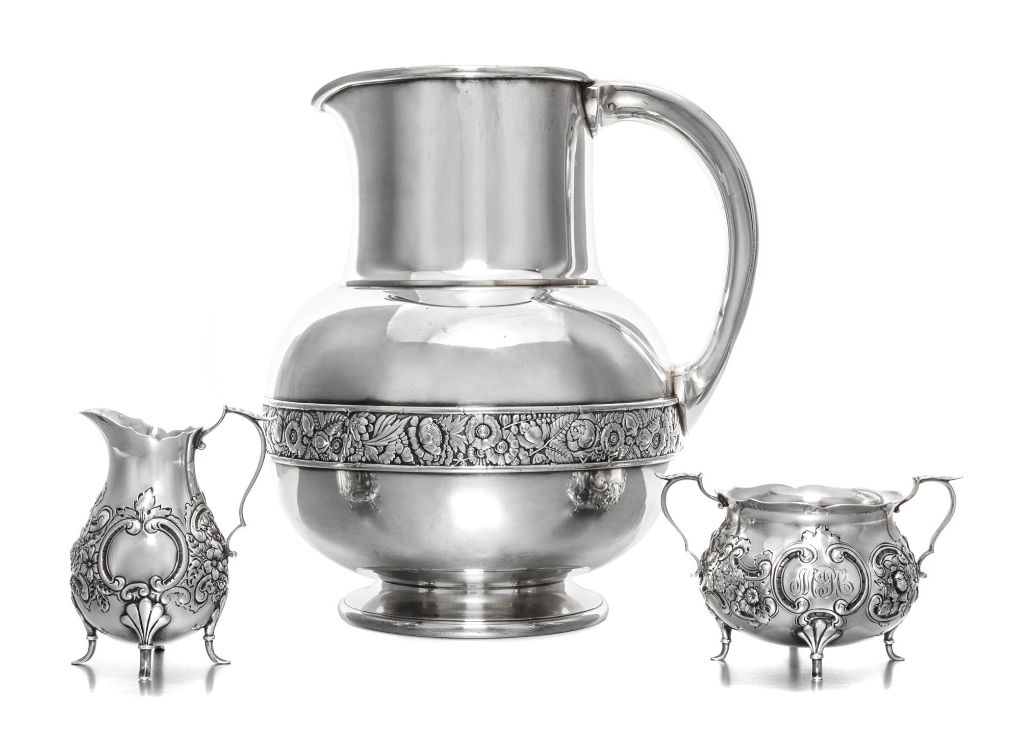 An American Silver Pitcher, Gorham Mfg. Co., Providence, RI, 1883, having a flattened spherical body with a cylindrical neck, the body