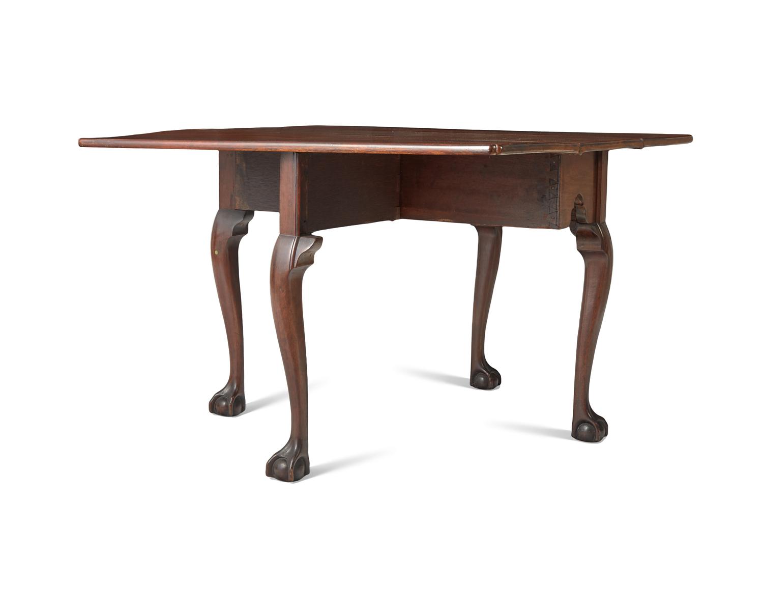 A Chippendale Carved and Figured Mahogany Drop-Leaf Dining Table, Philadelphia, PA, Circa 1775