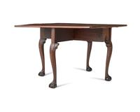 A Chippendale Carved and Figured Mahogany Drop-Leaf Dining Table, Philadelphia, PA, Circa 1775