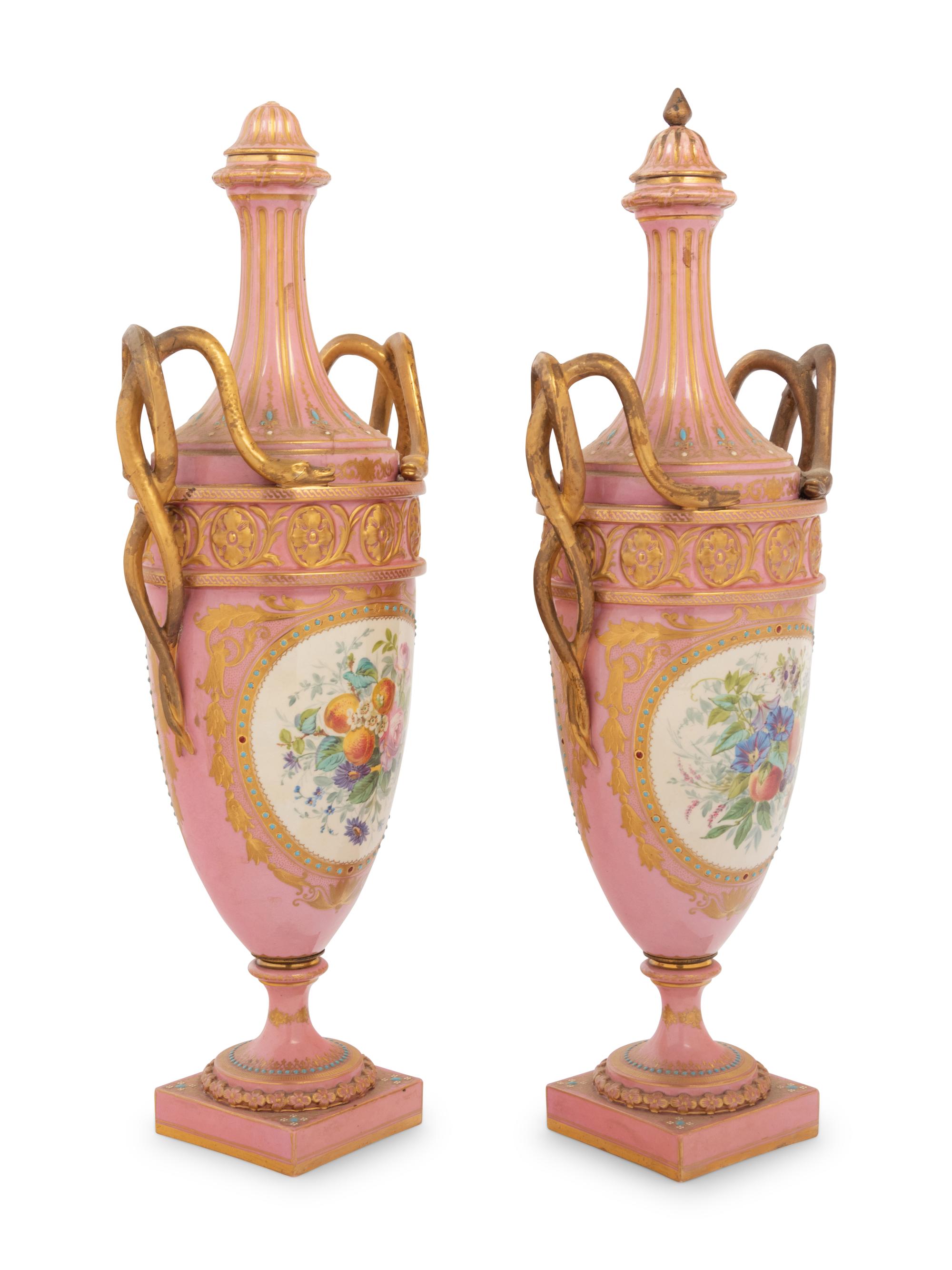 A Pair of Sèvres Style Parcel Gilt and "Jeweled" Porcelain Covered Urns