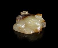 A Pale Celadon and Russet Jade Mask Length 1 1/8 inches.