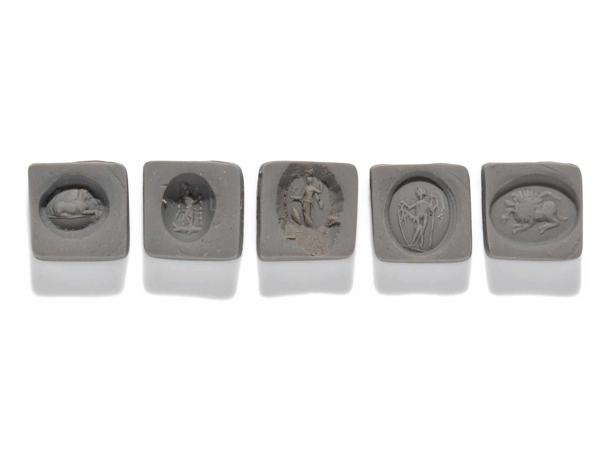 A Roman Iron Ring and Four Ring Stones
