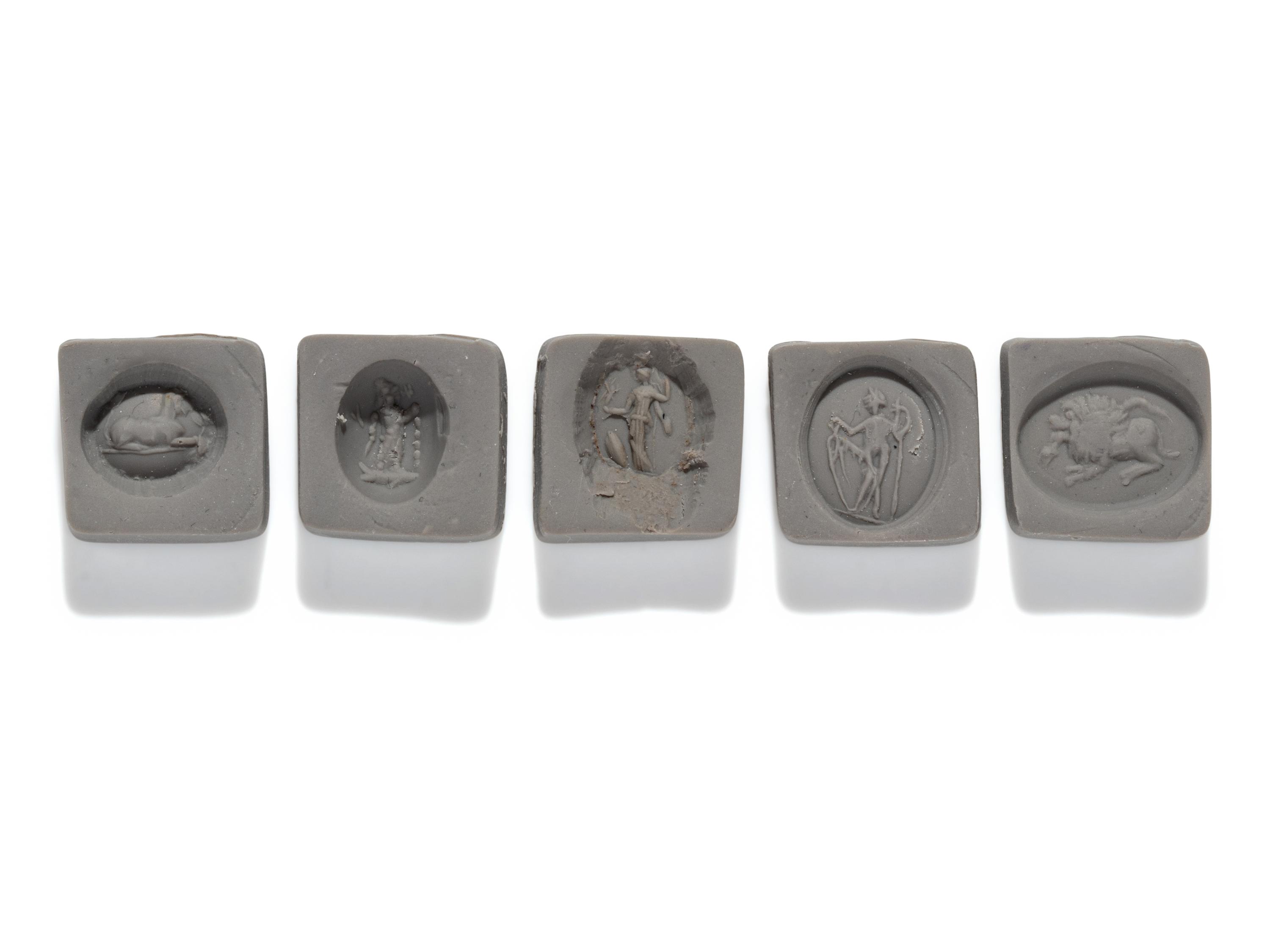 A Roman Iron Ring and Four Ring Stones