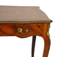 A Louis XV Style Gilt Metal Mounted Kingwood Writing Desk