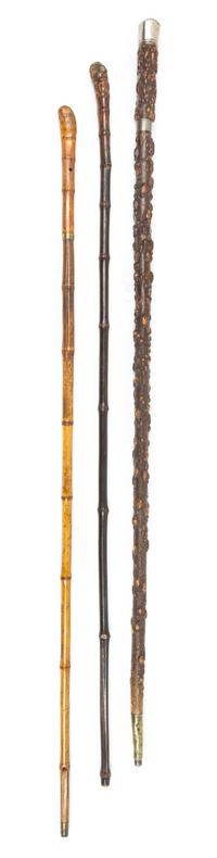 Three Rootwood Sword Canes Length of longest 36 1/8 inches.