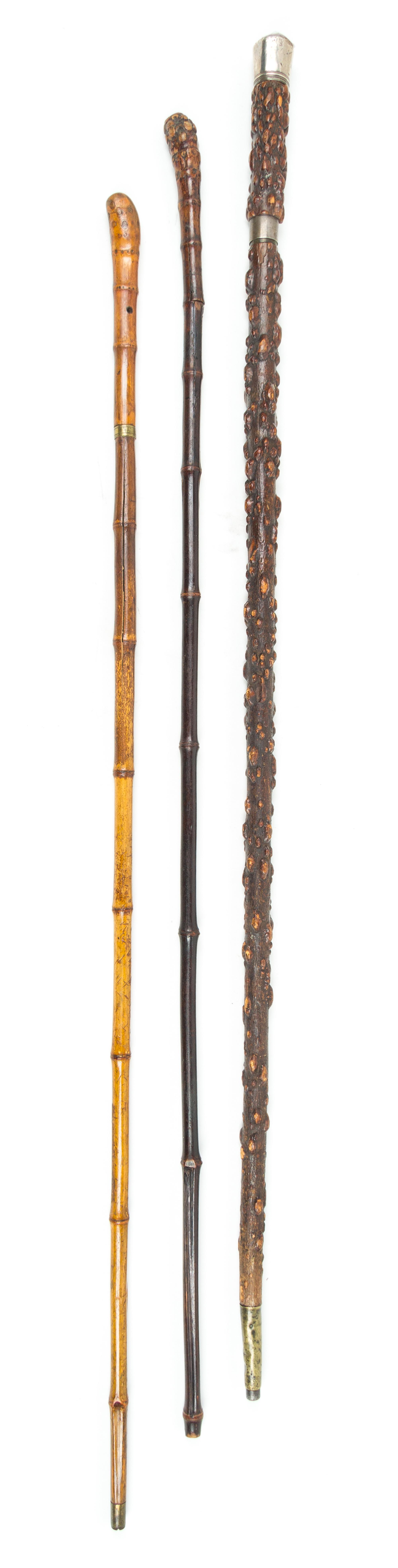 Three Rootwood Sword Canes Length of longest 36 1/8 inches.