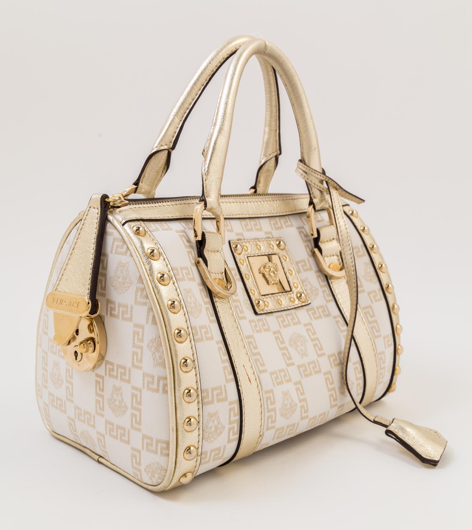 A Versace Metallic and Cream Monogram Handbag, 9.5" x 7" x 6"; Strap drop: 4".