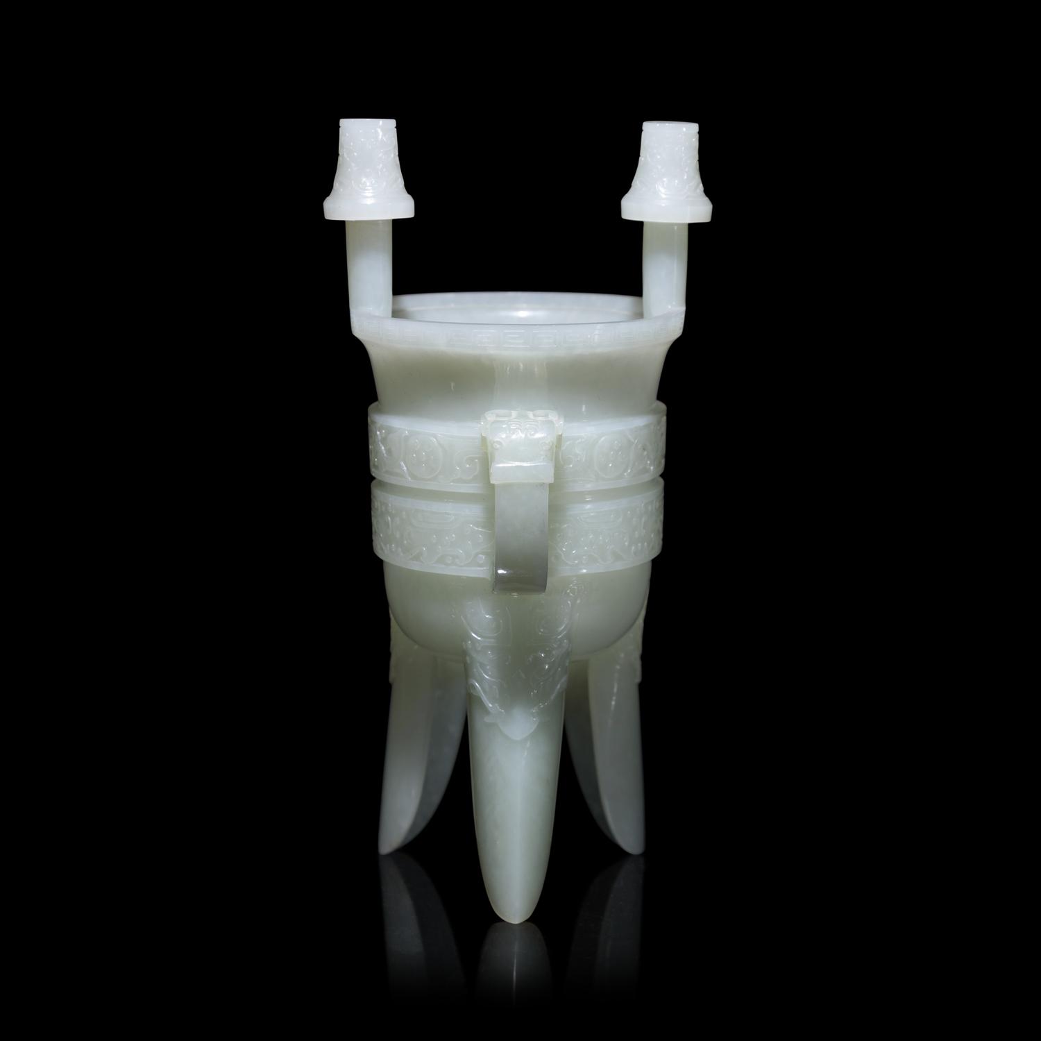 A Chinese Carved Pale Celadon Jade Tripod Vessel, Jia, Late Qing - Early Republic Period 晚清/民國 青白玉仿古斝