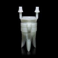 A Chinese Carved Pale Celadon Jade Tripod Vessel, Jia, Late Qing - Early Republic Period 晚清/民國 青白玉仿古斝