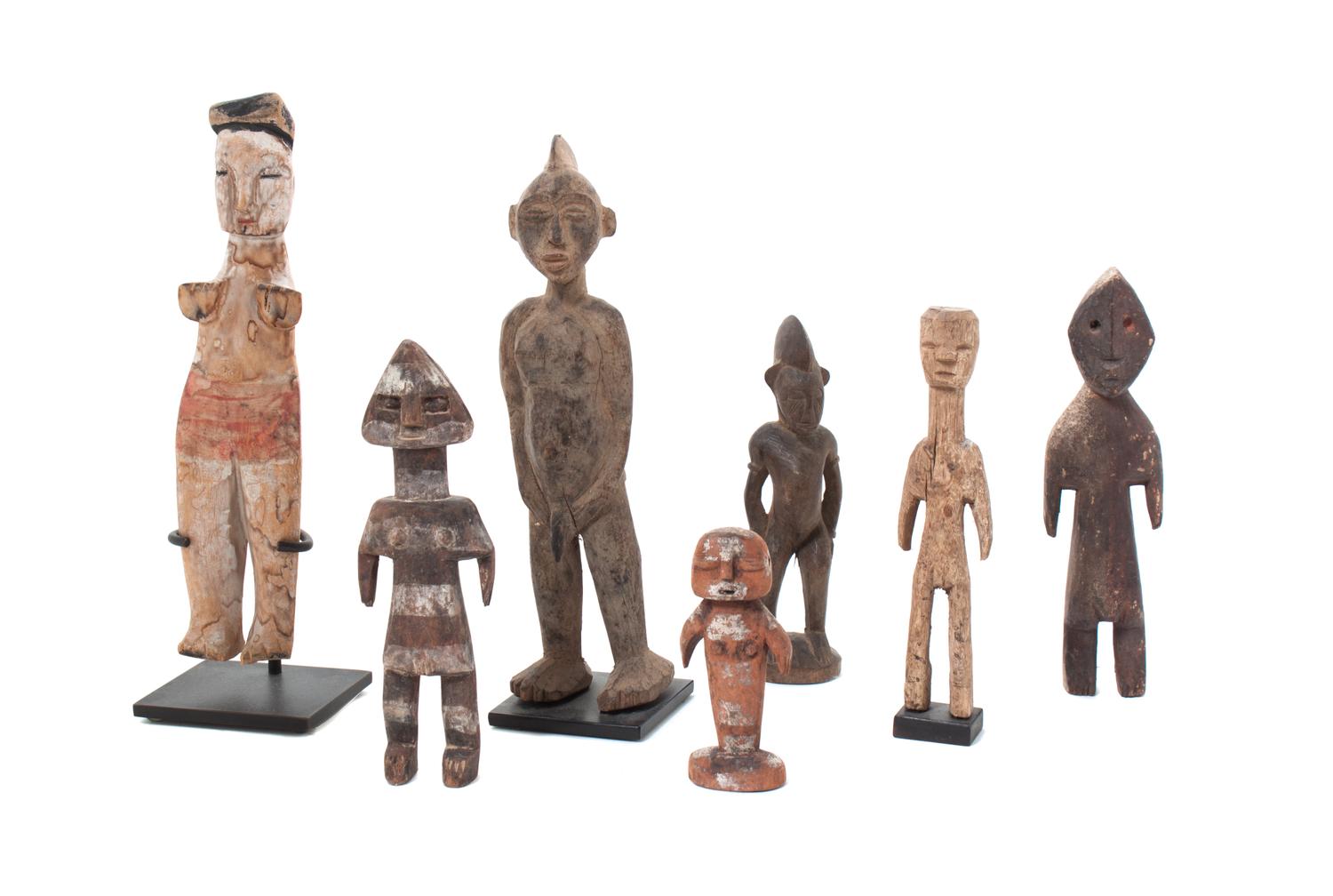 Seven Carved Wood African Figures Height of tallest 10 3/4 inches.