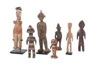 Seven Carved Wood African Figures Height of tallest 10 3/4 inches.
