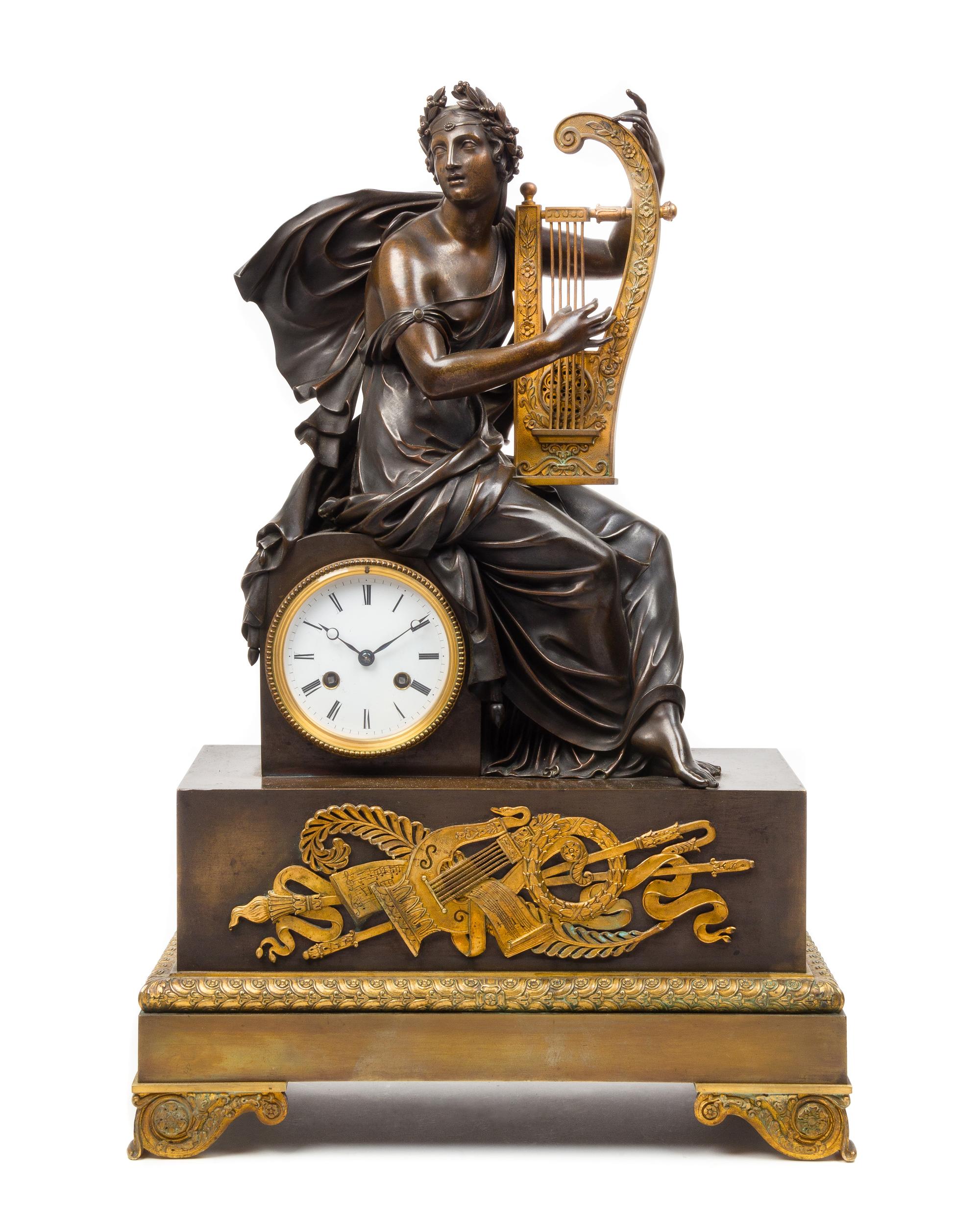 An Empire Style Gilt and Patinated Bronze Figural Mantel Clock Height 25 x width 16 3/8 x depth 6 7/8 inches. — 19TH CENTURY