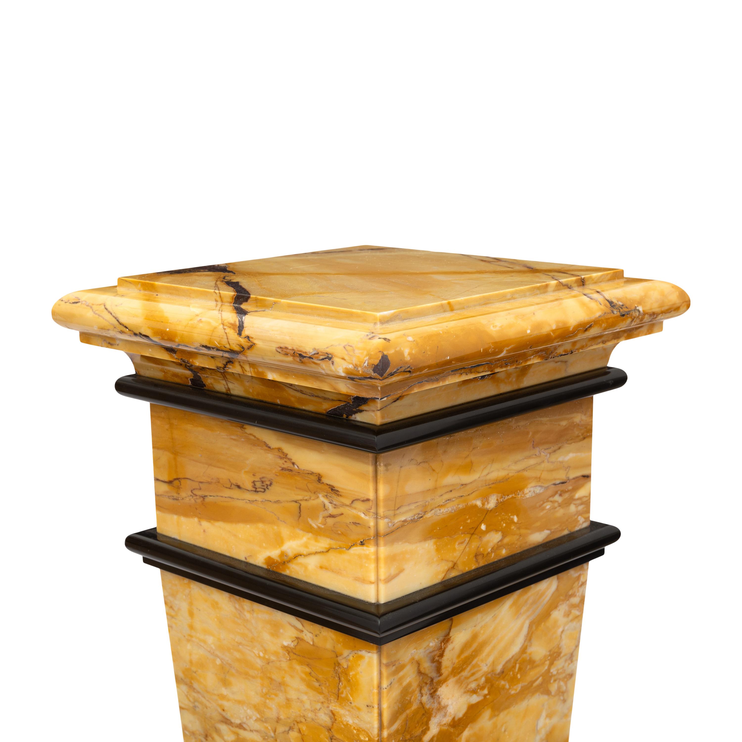 A Pair of Bi-Color Marble Pedestals