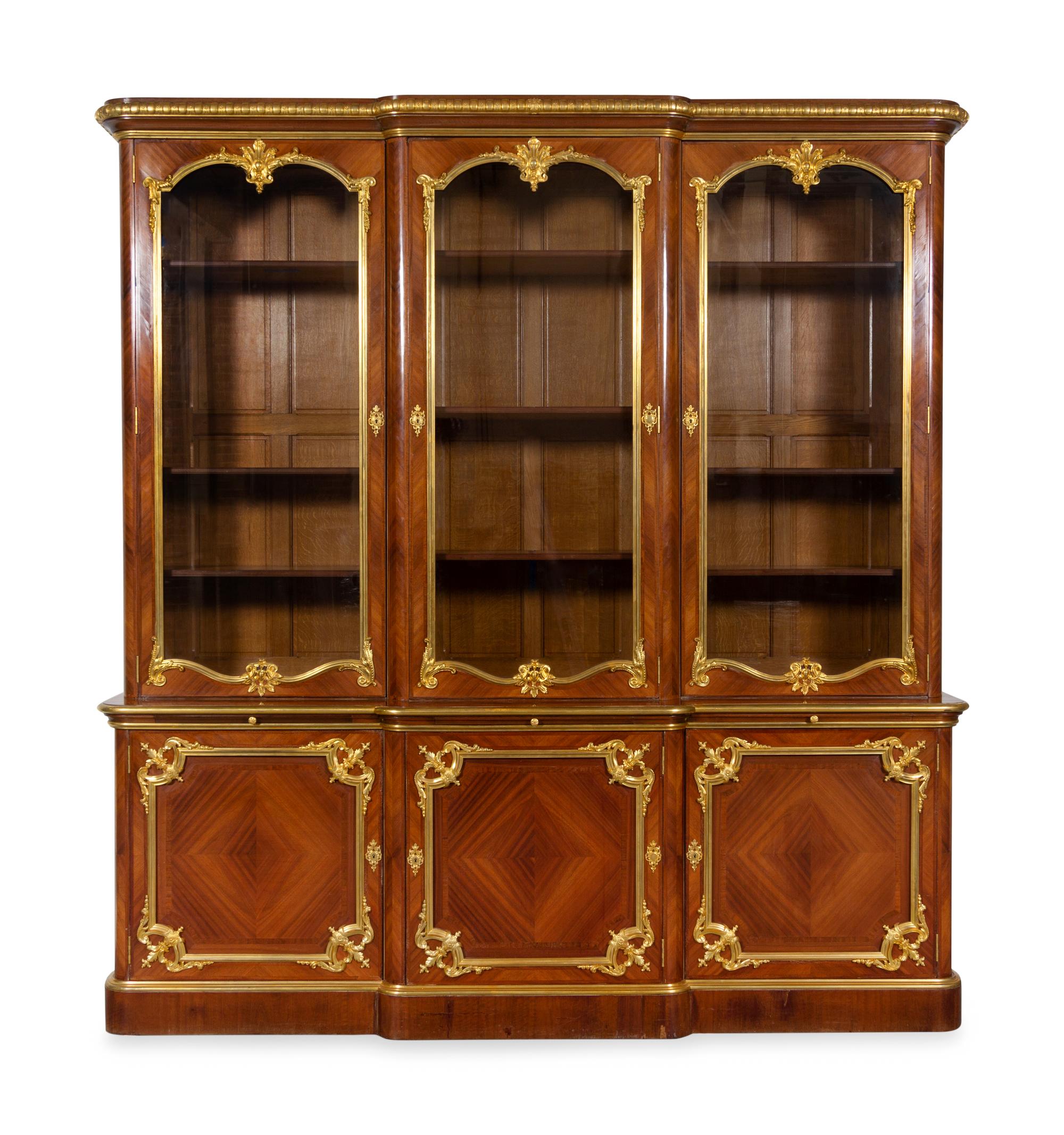 A Louis XV Style Gilt Bronze Mounted Kingwood Breakfront Cabinet