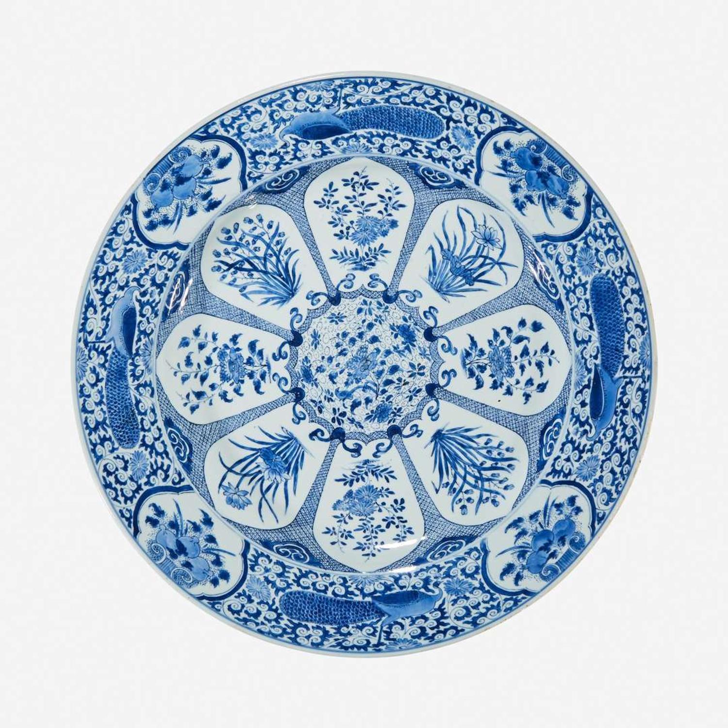 A large Chinese blue and white “Peacock and Rosette” charger Kangxi period