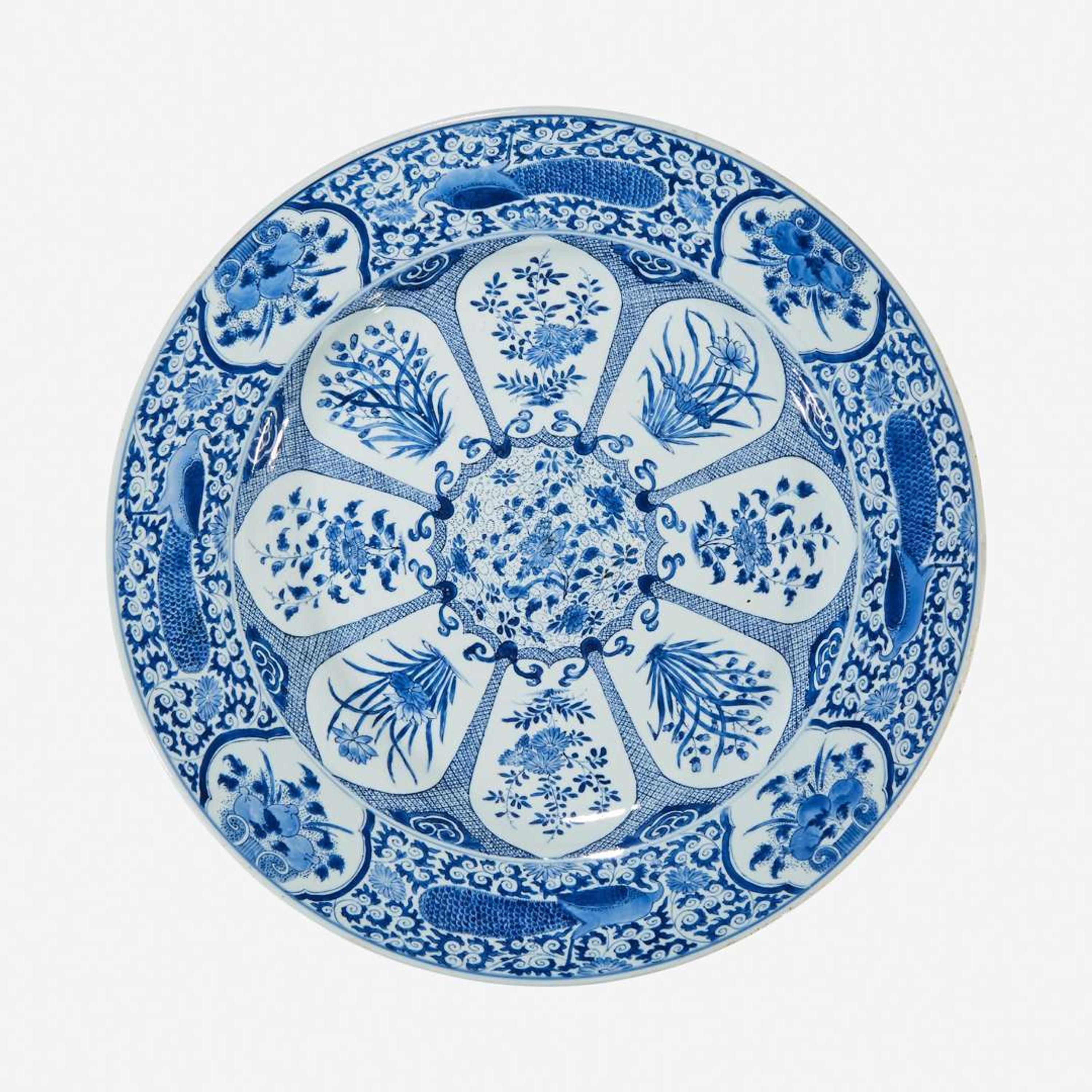 A large Chinese blue and white “Peacock and Rosette” charger Kangxi period