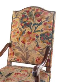 A Louis XIV Walnut Fauteuil à la Reine with Needlework Upholstery