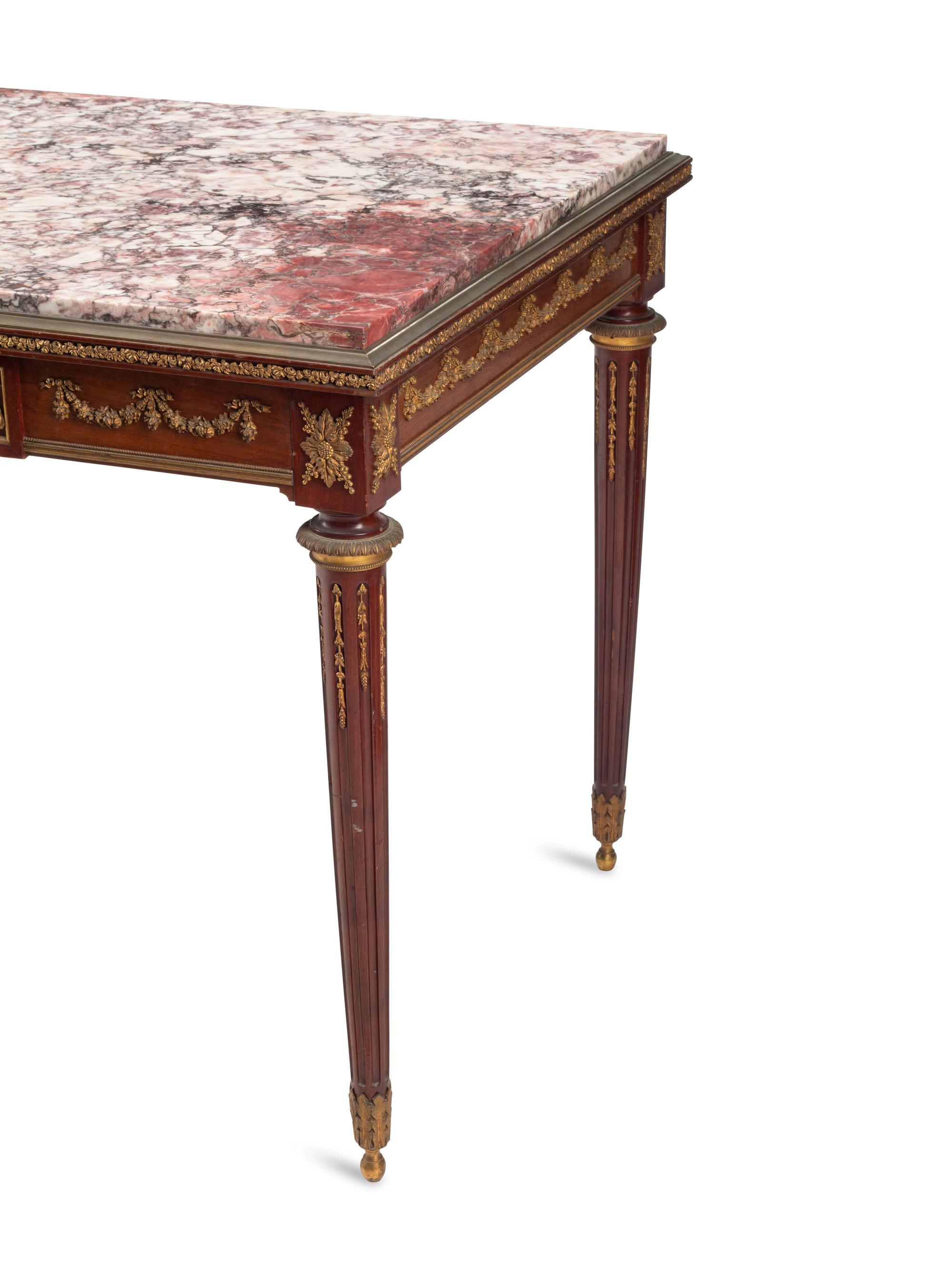 A Louis XVI Style Gilt Bronze Mounted Mahogany Marble-Top Table