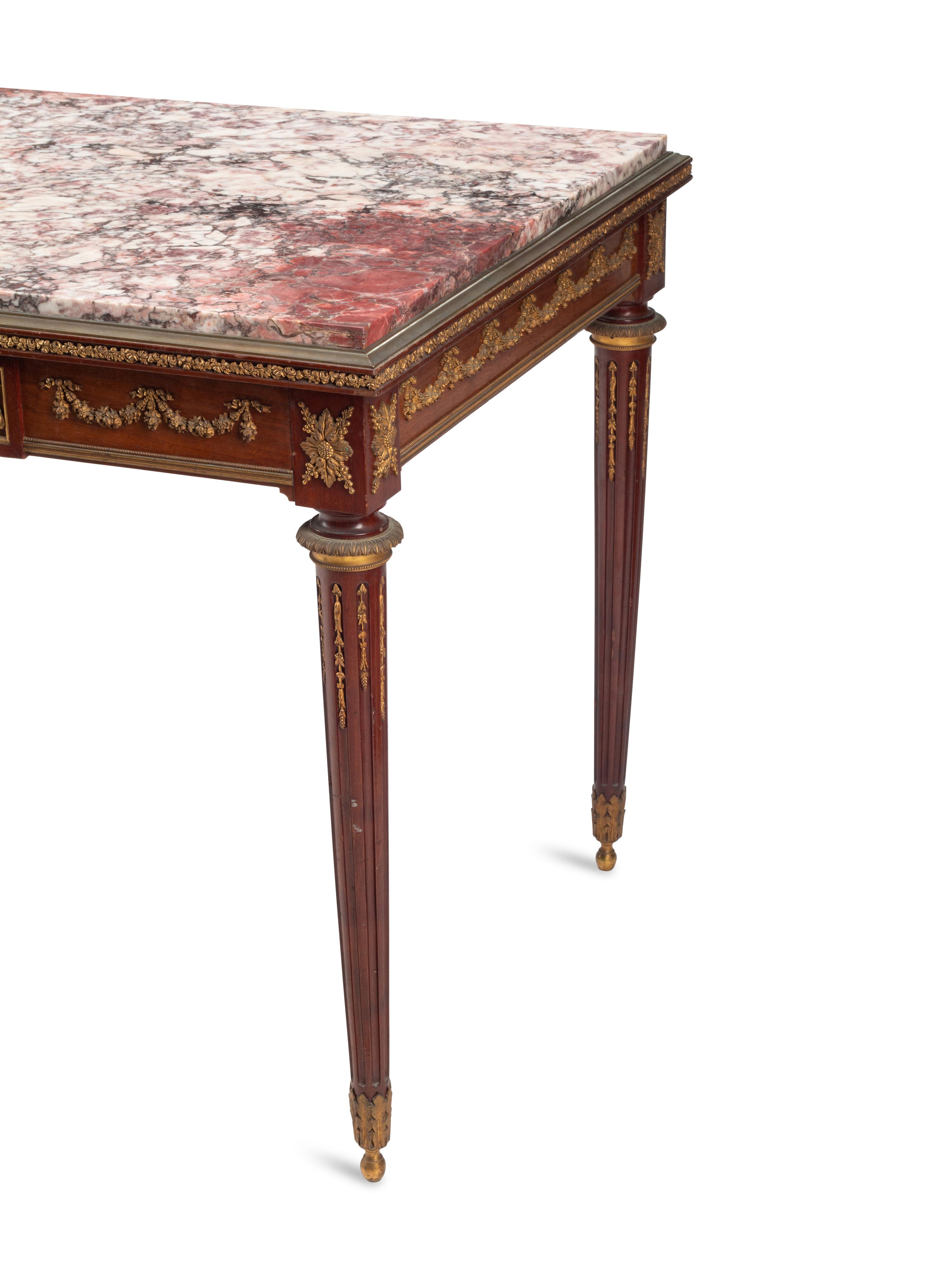 A Louis XVI Style Gilt Bronze Mounted Mahogany Marble-Top Table