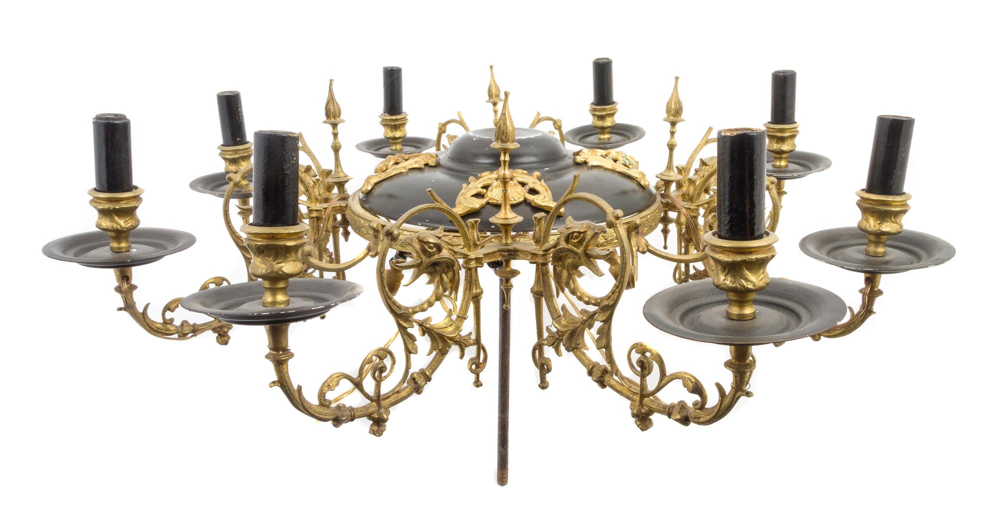 An Empire Style Gilt Bronze and Tole Eight-Light Chandelier Diameter 27 inches.