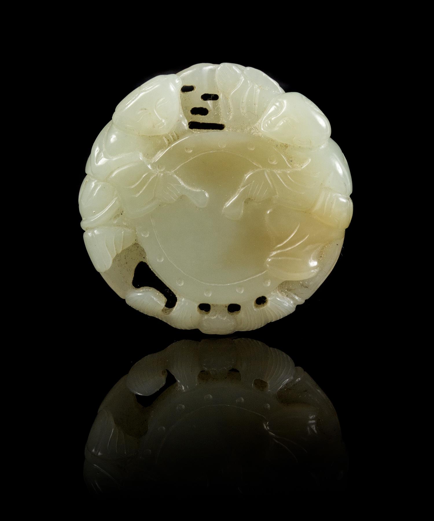 A Carved Jade Pendant Diameter 2 inches.