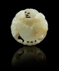 A Carved Jade Pendant Diameter 2 inches.