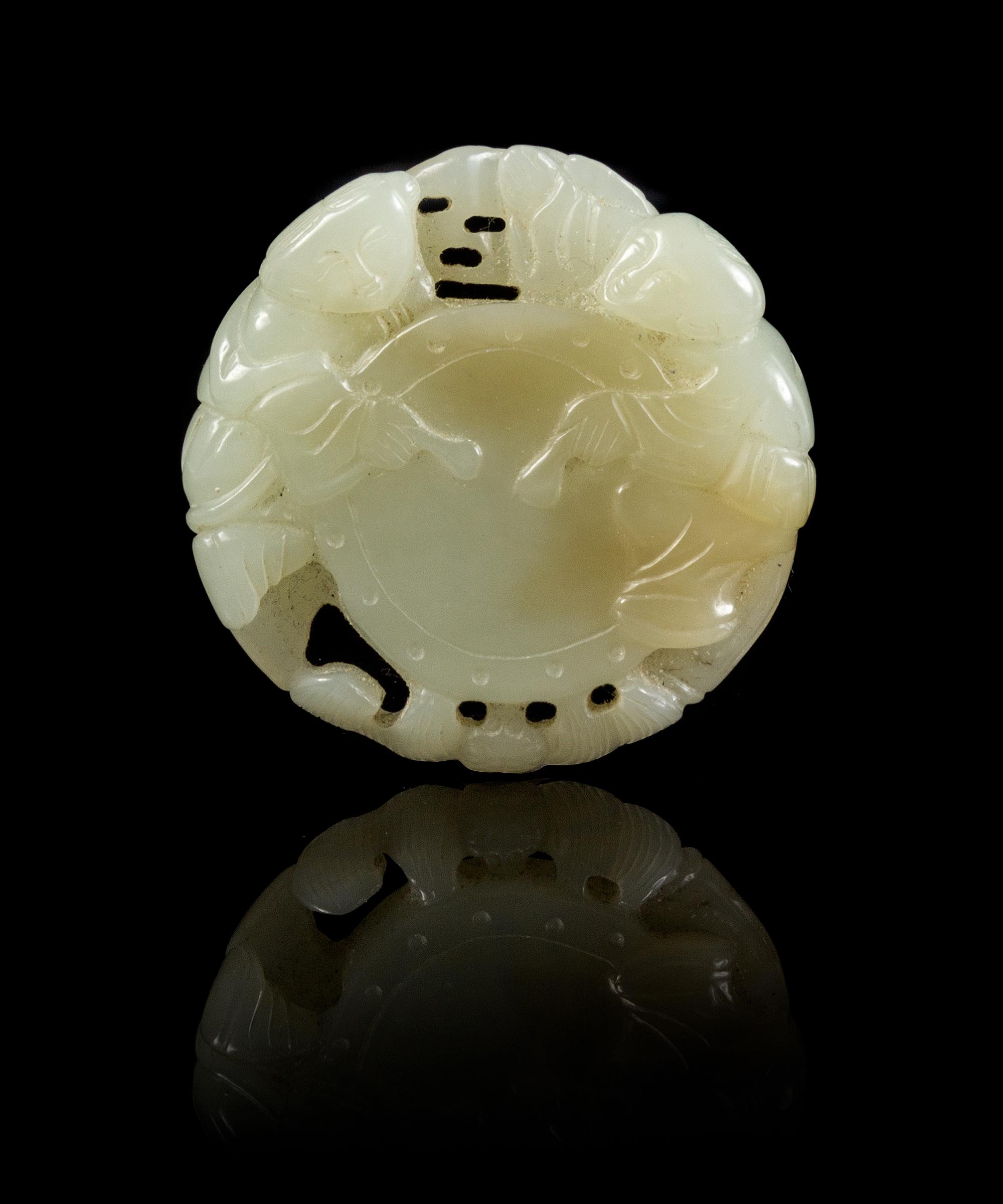 A Carved Jade Pendant Diameter 2 inches.