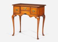 A Queen Anne style tiger maple dressing table, early 20th century